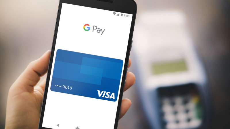 An image of a mobile phone with a Visa card connected to Google Pay for secure and fast transactions online and in-store. 
